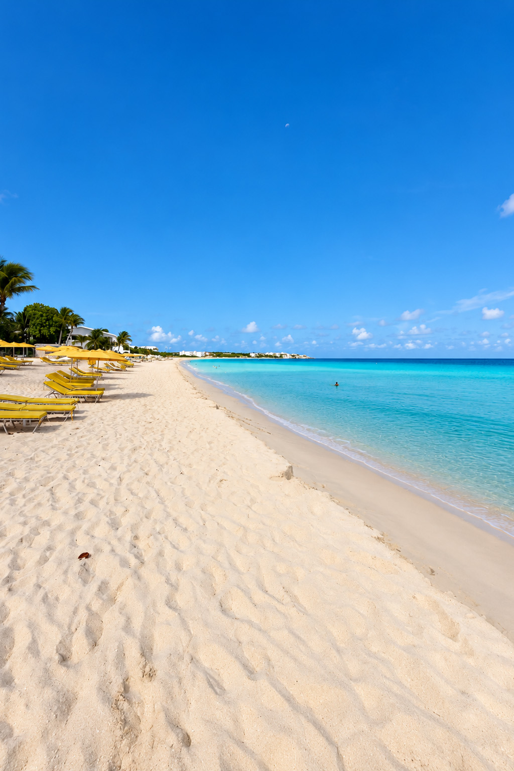 Turquoise water and a sunlit Caribbean beach